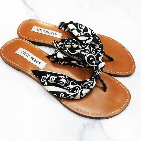 black fabric flip flops